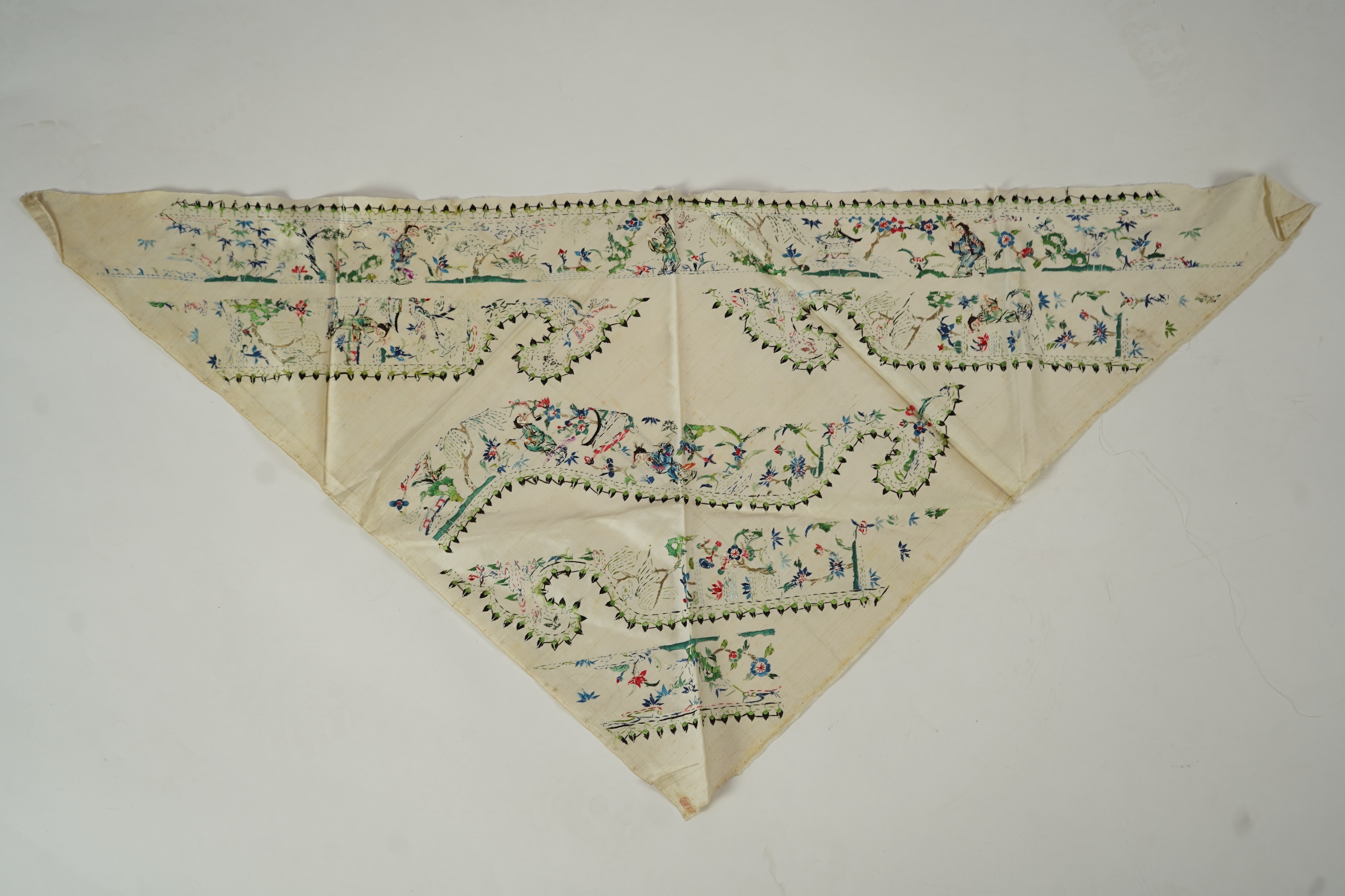 A Chinese embroidered silk panel of uncut robe borders, eleven similar sleeve panels and two other items, late Qing dynasty